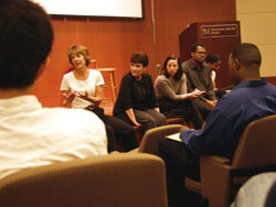 Faculty members and students discuss the medical issues presented in a play