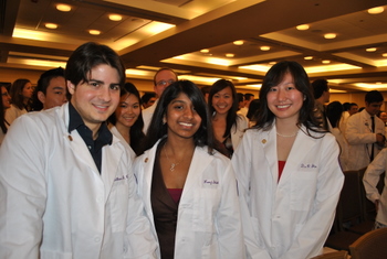 Students wearing embroidered coats