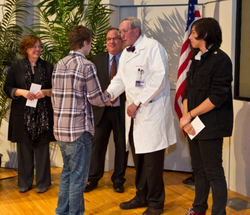 Eric Neilson, MD, dean of Northwestern University Feinberg School of Medicine, congratulates finalists of the third annual Martin Luther King Youth Art Contest