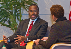 Keynote speaker Benjamin Carson, MD, talks with journalist Mary Mitchell onstage