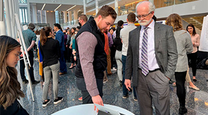 faculty and students in a conference au