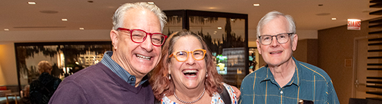 Alumni Weekend Welcome Reception: 3 Classmates Smiling
