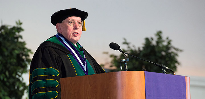 The dean speaking during the ceremony