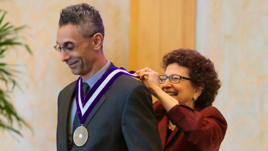 Dr. Paller giving out a medal