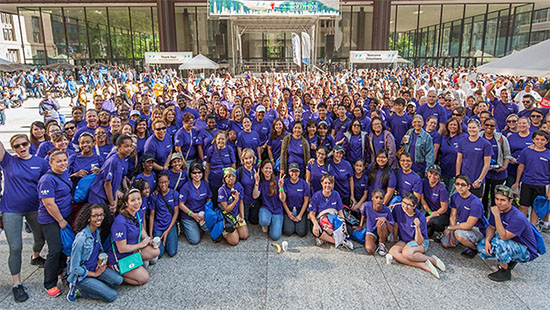 Northwestern Medicine group shot all wearing NM purple tshirts