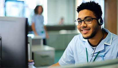 An IT technician at his computer