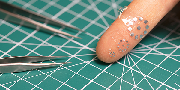 Shape-Shifting Ultrasound Stickers Detect Post-Surgical Complications