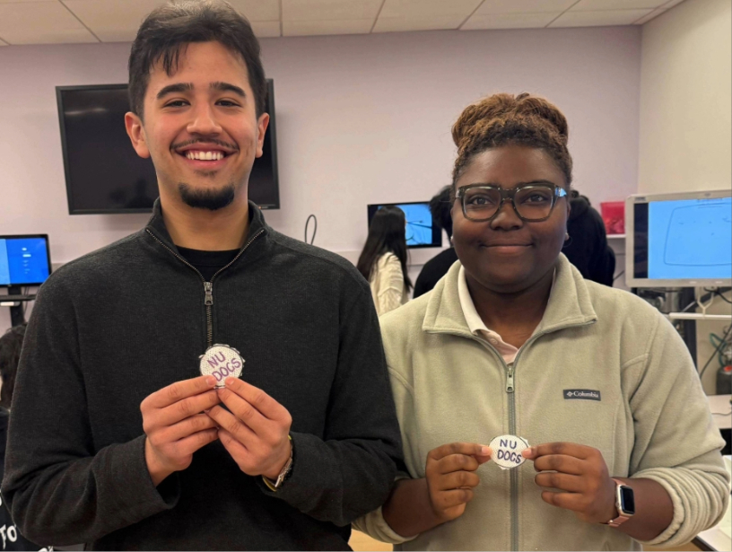Two students smiling