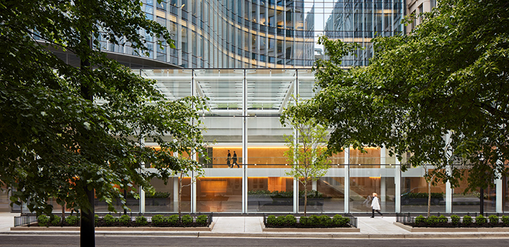 A view from the street of people walking through the Simpson Querrey Biomedical Research Institute