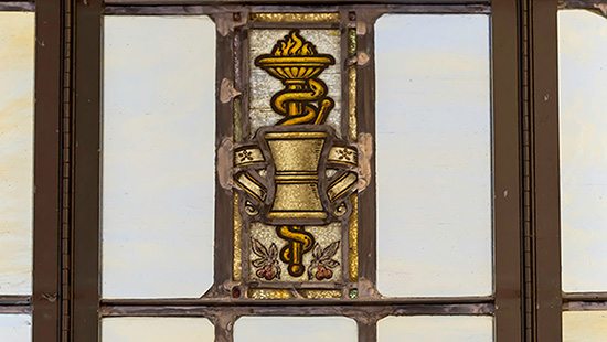 emblem in glass window at Galter Library 