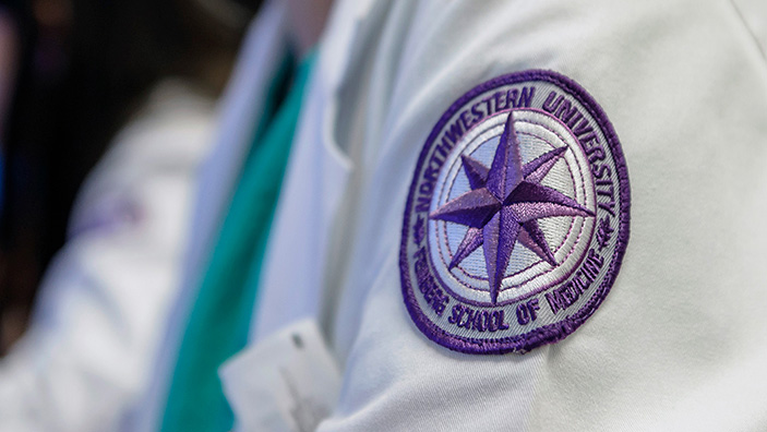 Feinberg MD patch on white coat