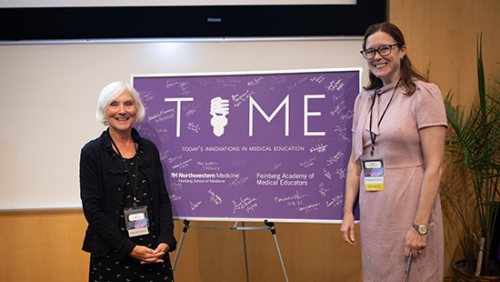 Two faculty members presenting at a conference