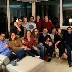 Residents posing for a group photo at a holiday party.