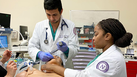 Residents practicing on a dummy