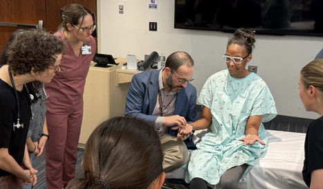 A Family Medicine resident speaks with a patient