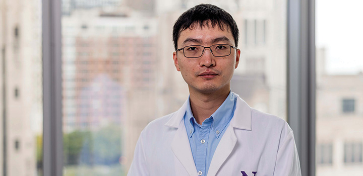 Headshot of Bin Zheng in lab coat