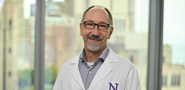 Headshot of Dan Foltz, PhD, in lab coat