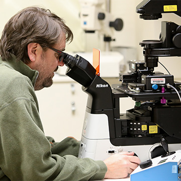 Headshot of Brian Mitchell in a lab