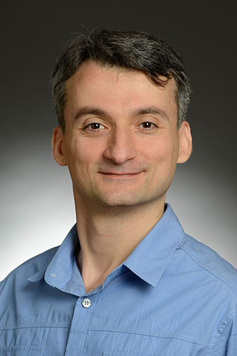 Ertugrul Ozbudak wearing a blue shirt