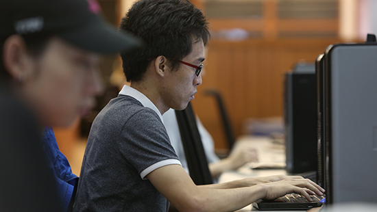A Northwestern Student working at their computer