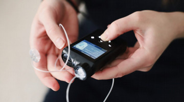 person measuring blood sugar