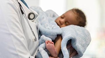 doctor holding baby 