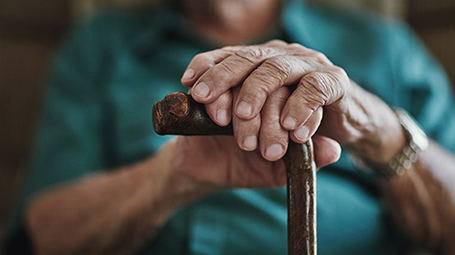 Aging hands and cane