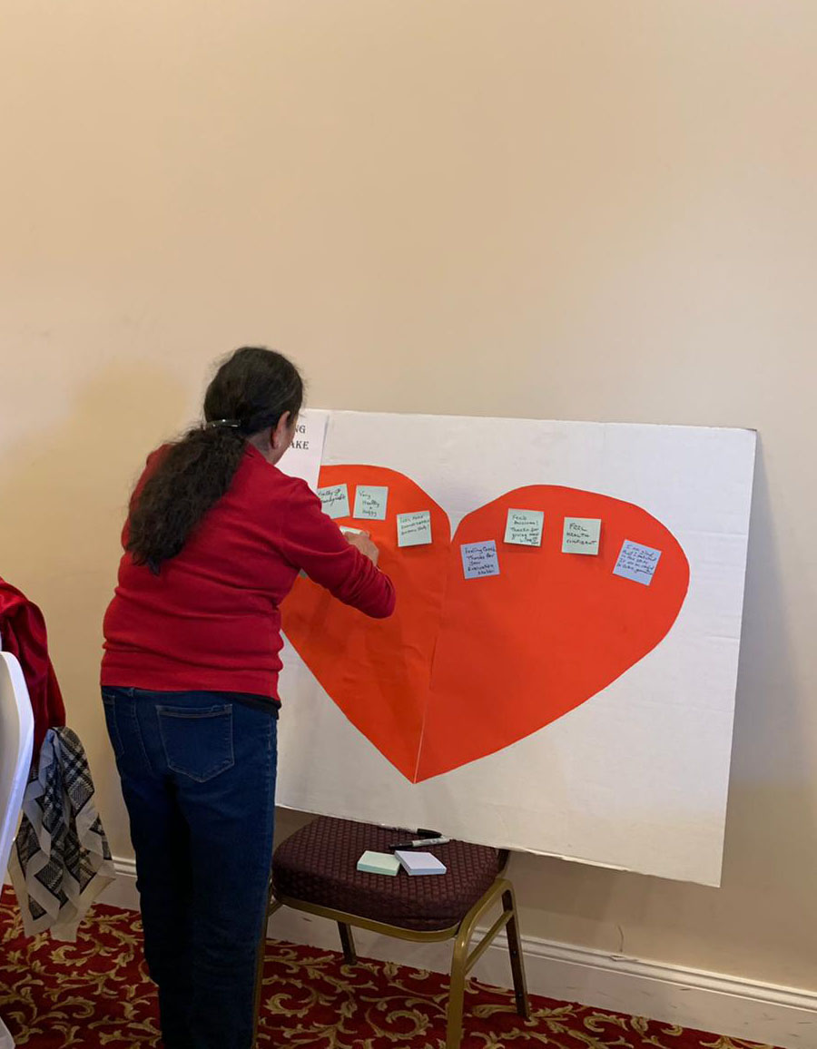 Attendee adding note to poster