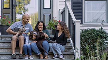 photo of family in front of their house