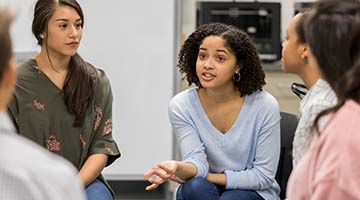photo of teen girls talking 