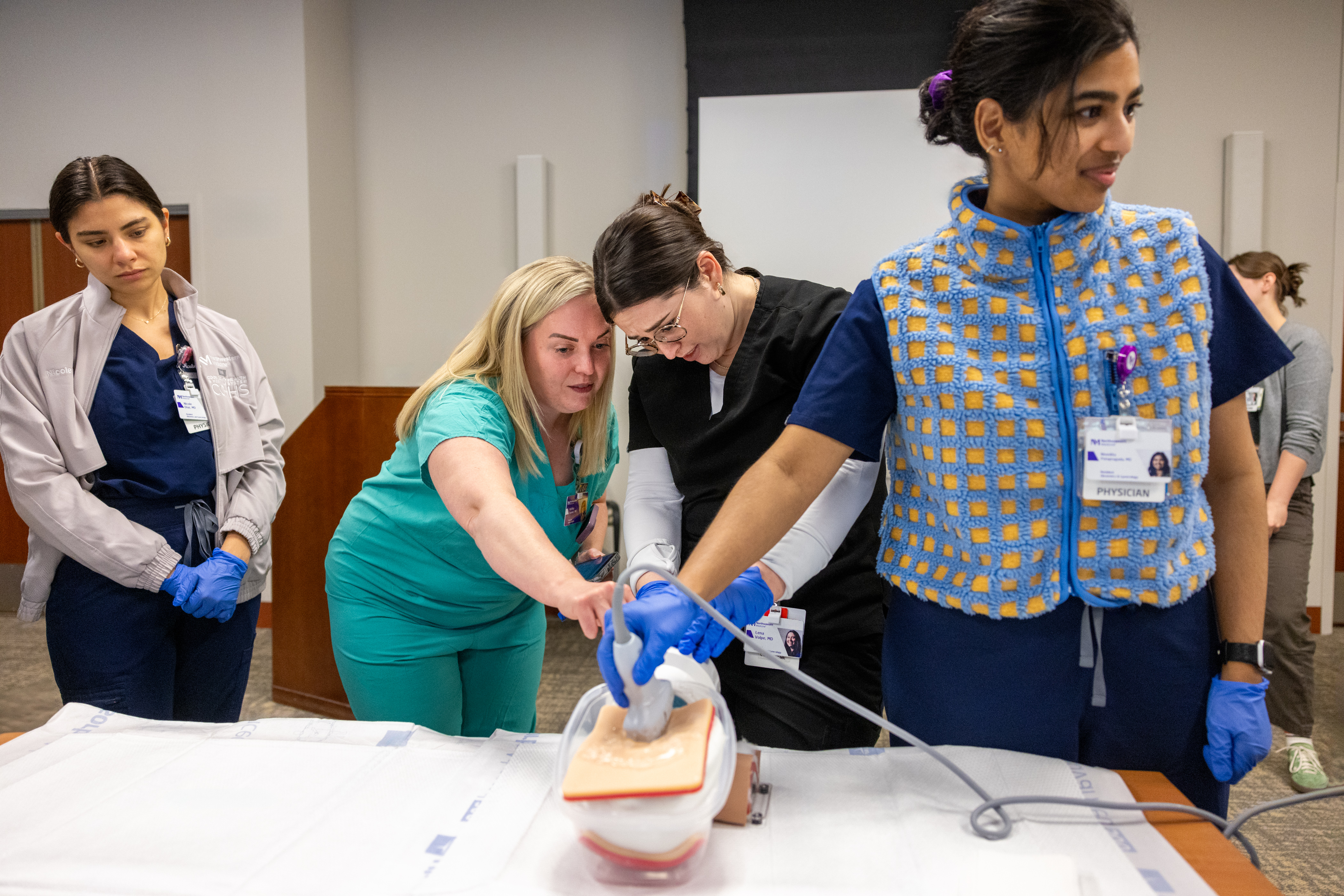 Doctors demonstrating a hospital simulation exercise